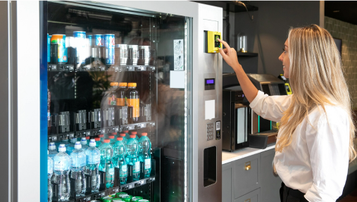 Customer using a Nayax payment device on a vending machine